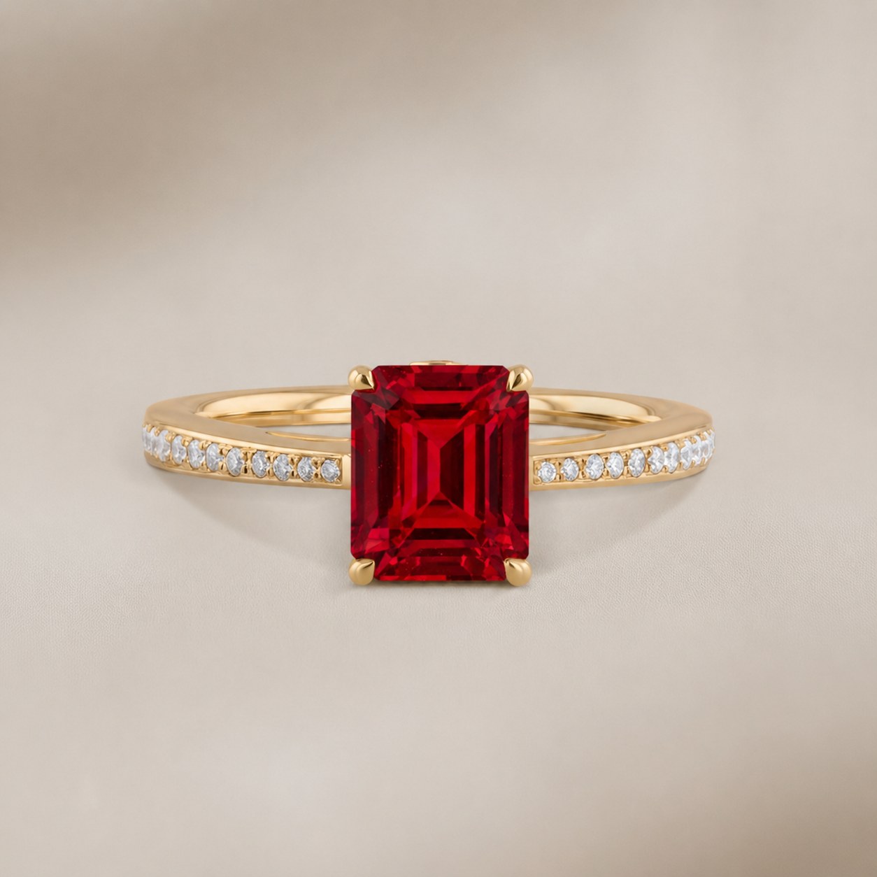 Emerald-cut ruby ring in yellow gold with diamond pavé band